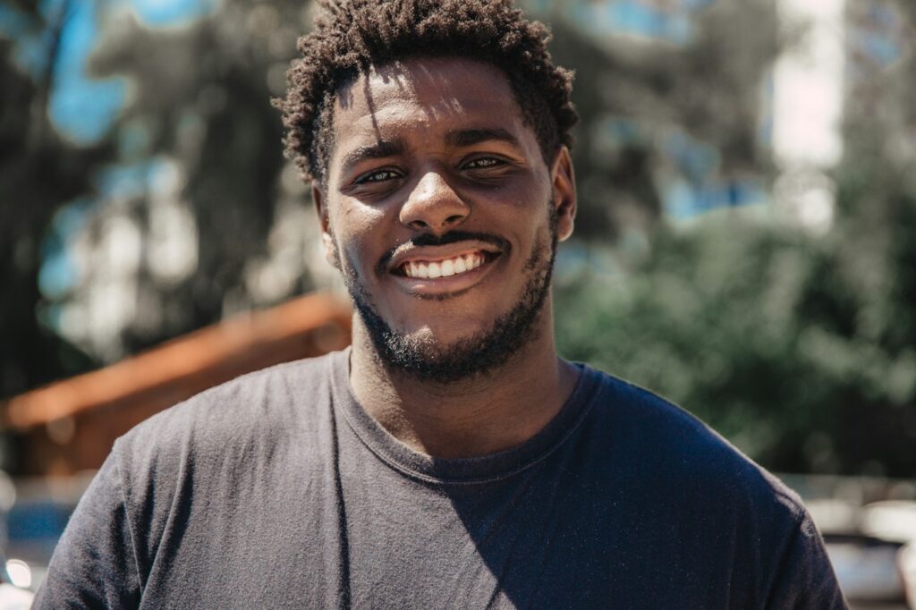 Man smiling outdoors