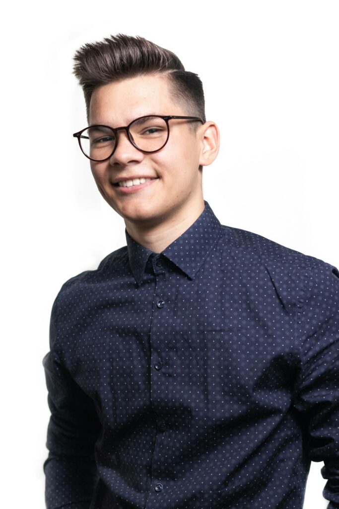 Smiling man in black glasses
