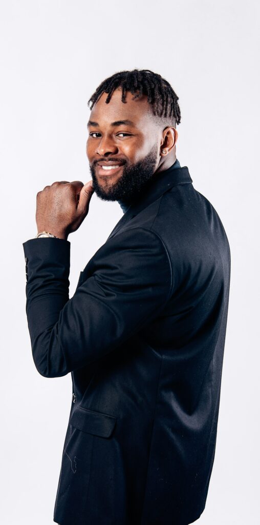 Smiling man in a black long-sleeve shirt