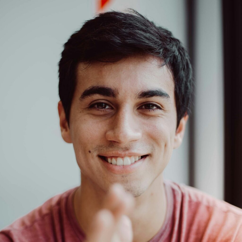 Smiling man in a red shirt